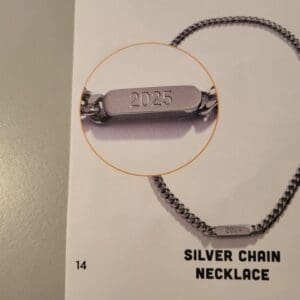 Silver chain necklace with 2025 tag.