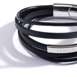 Black leather bracelet with a silver clasp and engraved plate.