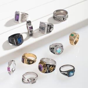 A collection of various men's rings with different gemstones and designs.